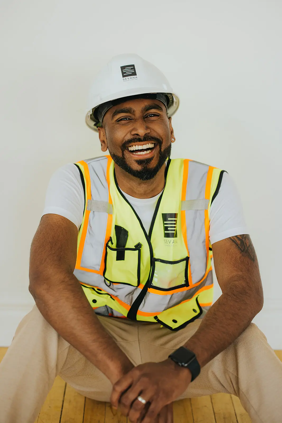 a construction site with a large excavator or bulldozer in the process of lifting a cement slab or bridge section