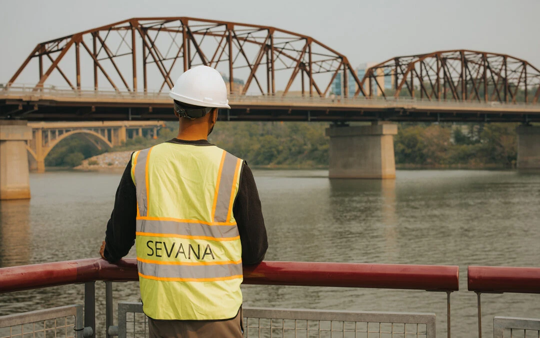 Civil engineer planning climate-resilient infrastructure using disaster mitigation and nature-based solutions.